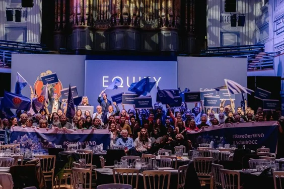 A group of Equity members flying purple branded flags and banners to save the WNO, inside Birmingham Town Hall.